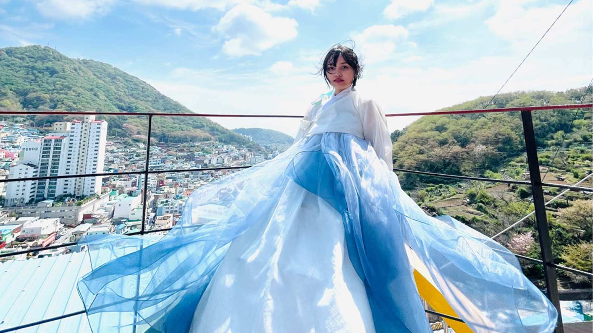 Experience the charm of Gamcheon Culture Village while dressed in a beautiful hanbok. Explore the colorful surroundings and make lasting memories with stunning photos capturing this unique moment.